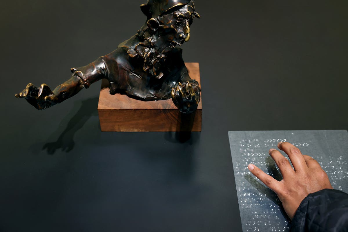 Tanmay Govindraj reads braille at the Tactile Gallery, which is a culmination of the work between the FAC and the Colorado School for the Deaf and the Blind. Photo by Jamie Cotten / Colorado College